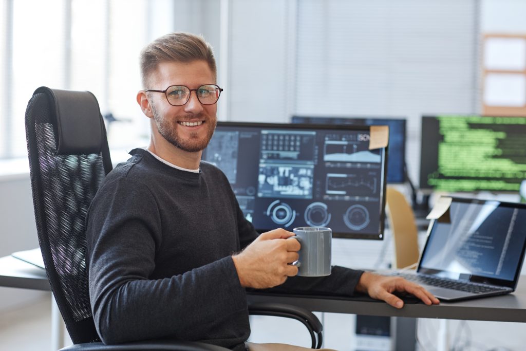smiling software programmer at workplace 2022 10 25 10 13 28 utc