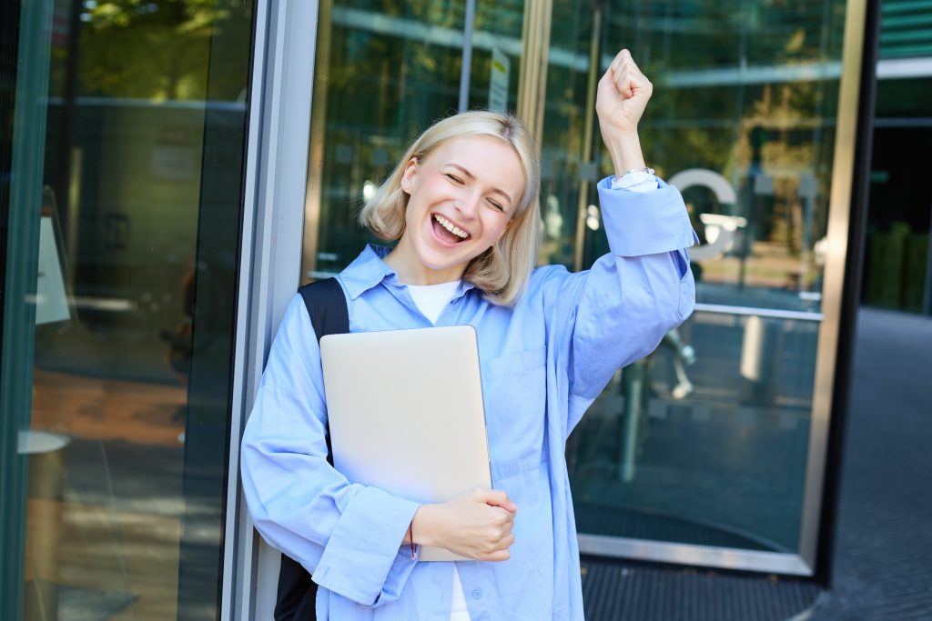carefree blond woman laughing smiling and celebra 2023 11 27 05 13 45 utc